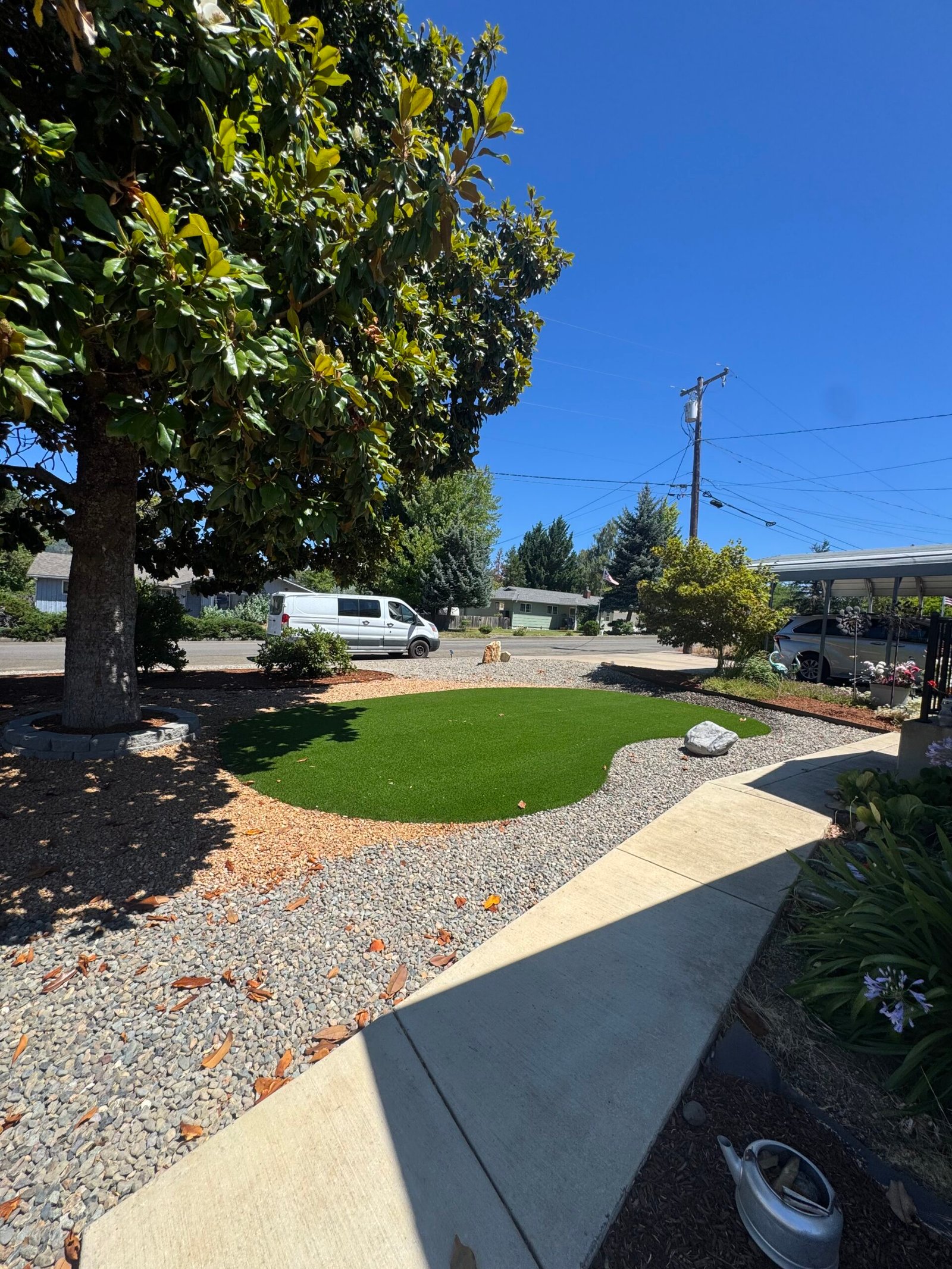 Front yard artificial turf accent with landscape rock